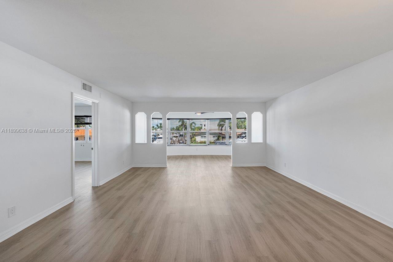3111 Northeast 51st Street, Unit 202C Fort Lauderdale, FL 33308 - Photo 17 of 46 a view of an empty room and window