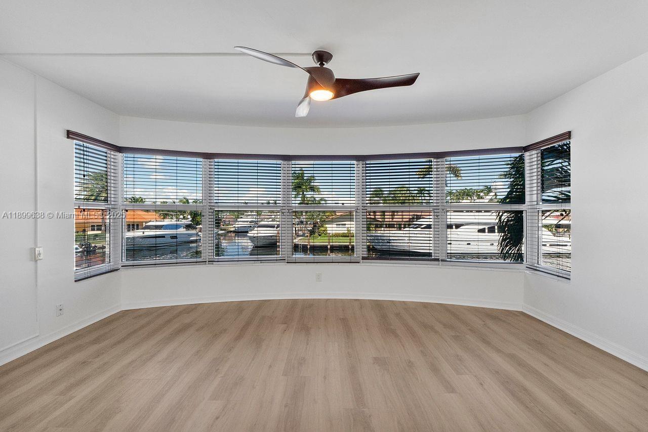 3111 Northeast 51st Street, Unit 202C Fort Lauderdale, FL 33308 - Photo 31 of 46 a living room with furniture and a large window
