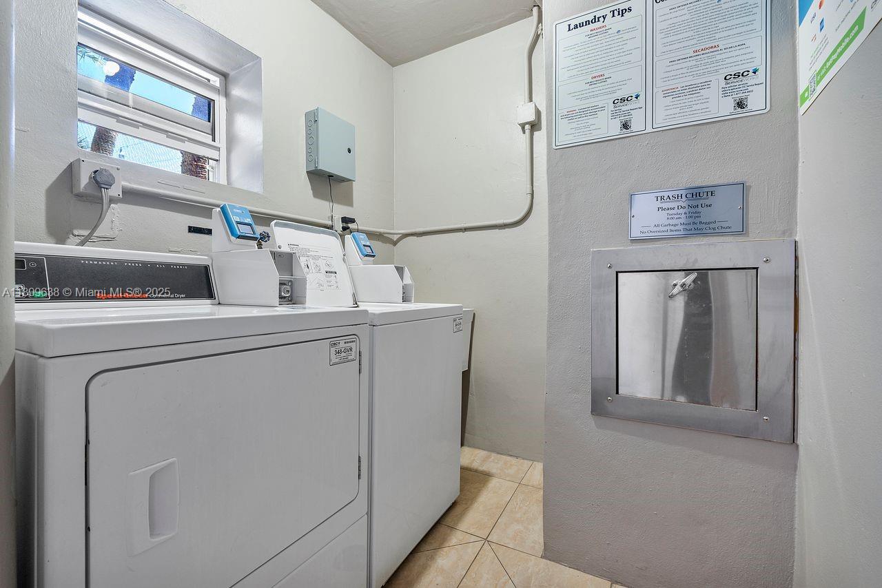 3111 Northeast 51st Street, Unit 202C Fort Lauderdale, FL 33308 - Photo 32 of 46 a utility room with dryer and washer