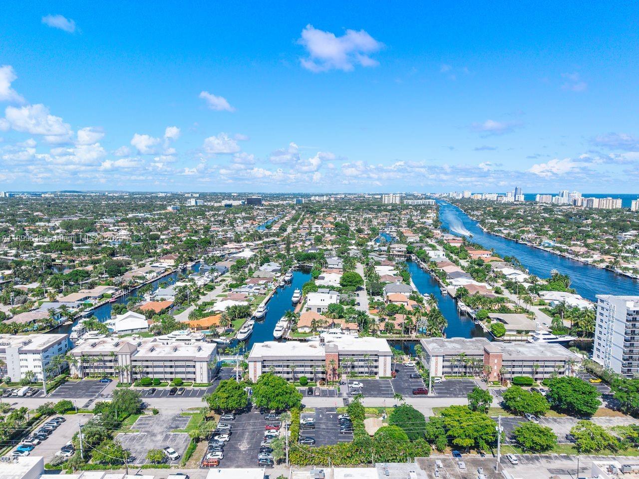 3111 Northeast 51st Street, Unit 202C Fort Lauderdale, FL 33308 - Photo 38 of 46 an aerial view of residential building with green space