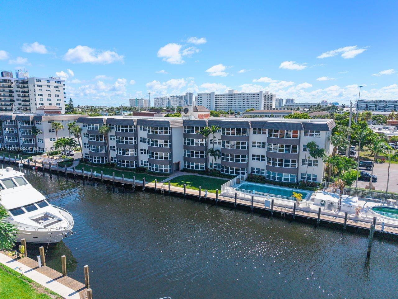 3111 Northeast 51st Street, Unit 202C Fort Lauderdale, FL 33308 - Photo 42 of 46 a view of a city with tall buildings