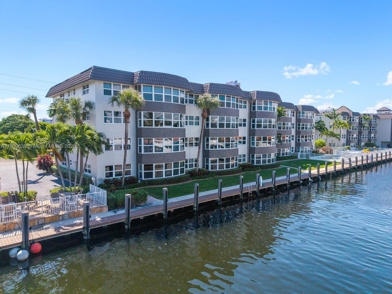 3111 Northeast 51st Street, Unit 202C Fort Lauderdale, FL 33308 - Photo 44 of 46 a view of a lake and a city