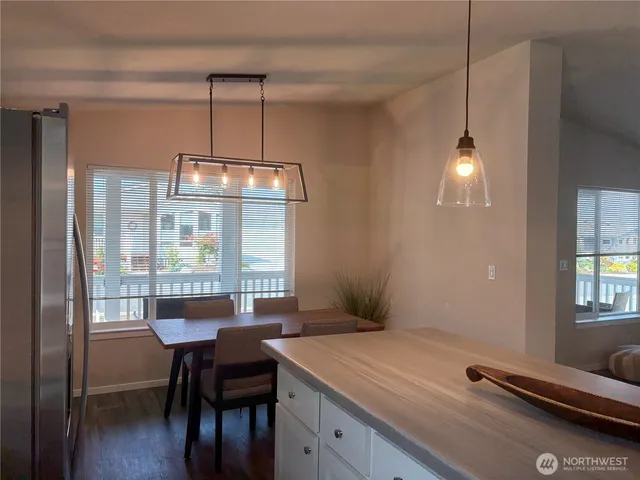 a living room with furniture a window and a flat screen tv