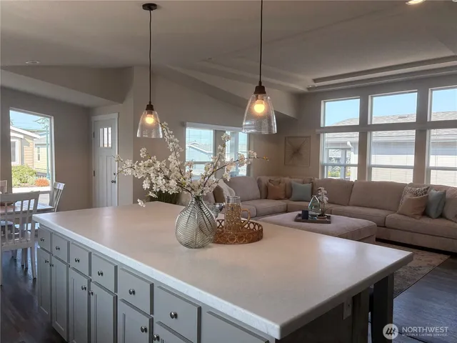 a living room with furniture and a table