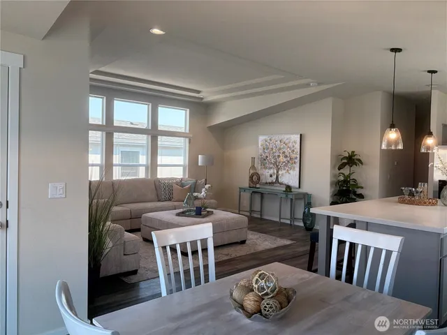 a kitchen with kitchen island a sink stove and refrigerator