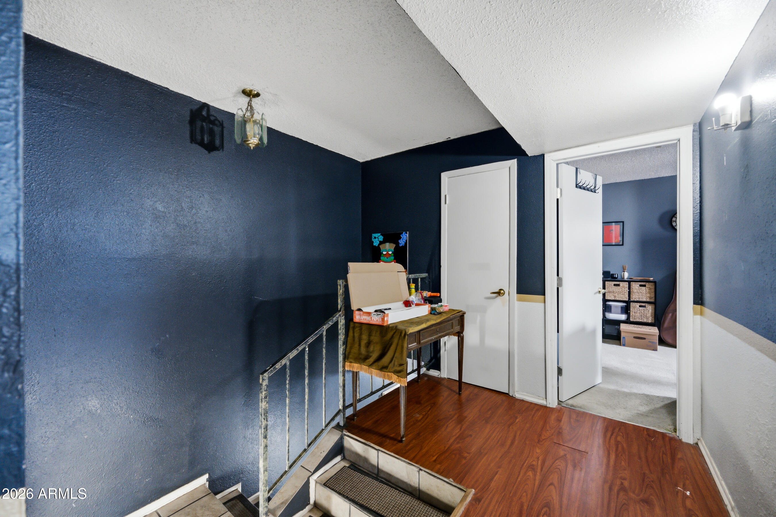 1051 South Dobson Road, Unit 187 Mesa, AZ 85202 - Photo 14 of 18 a view of a workspace with furniture and wooden floor