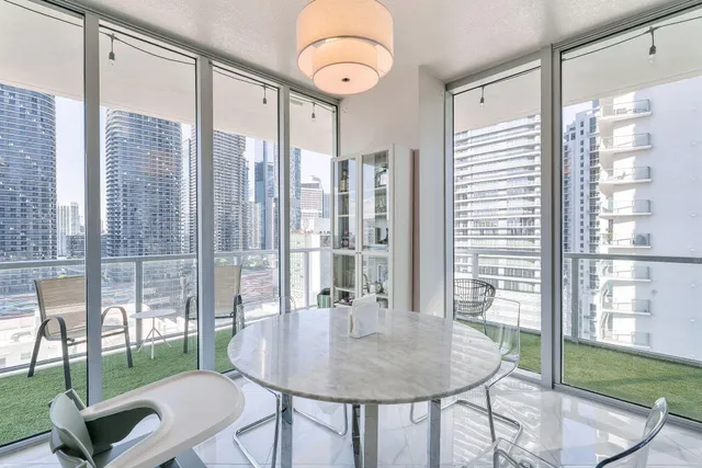 a view of a dining room with furniture window and outside view