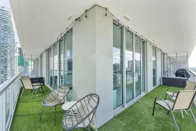 a view of balcony with furniture
