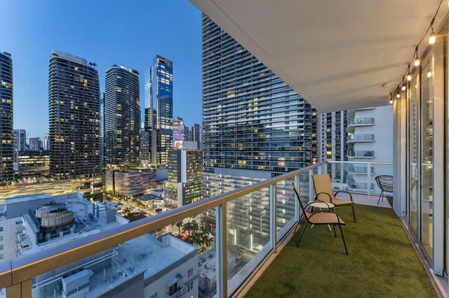 a view of a balcony with chairs