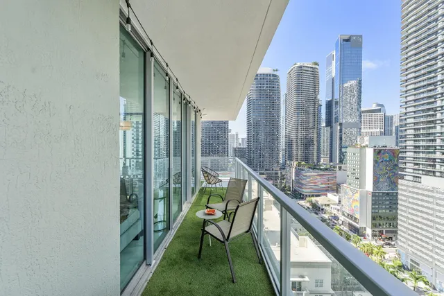 a view of a bathroom with washing machine and a sink