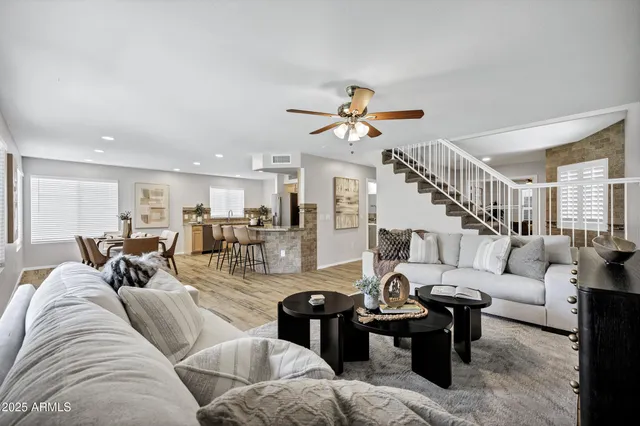 a living room with furniture and a large window