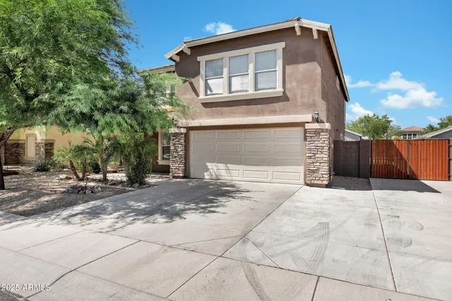a front view of a house with a garage