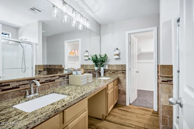 a bathroom with a shower and a bath tub
