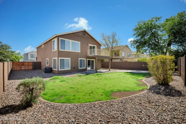 a view of a back yard of the house