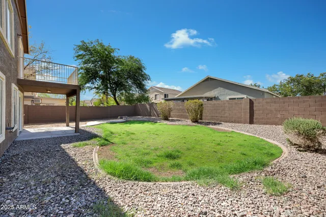 a view of a backyard of the house