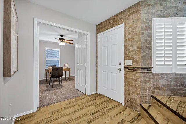 a view of a workspace with furniture and entryway