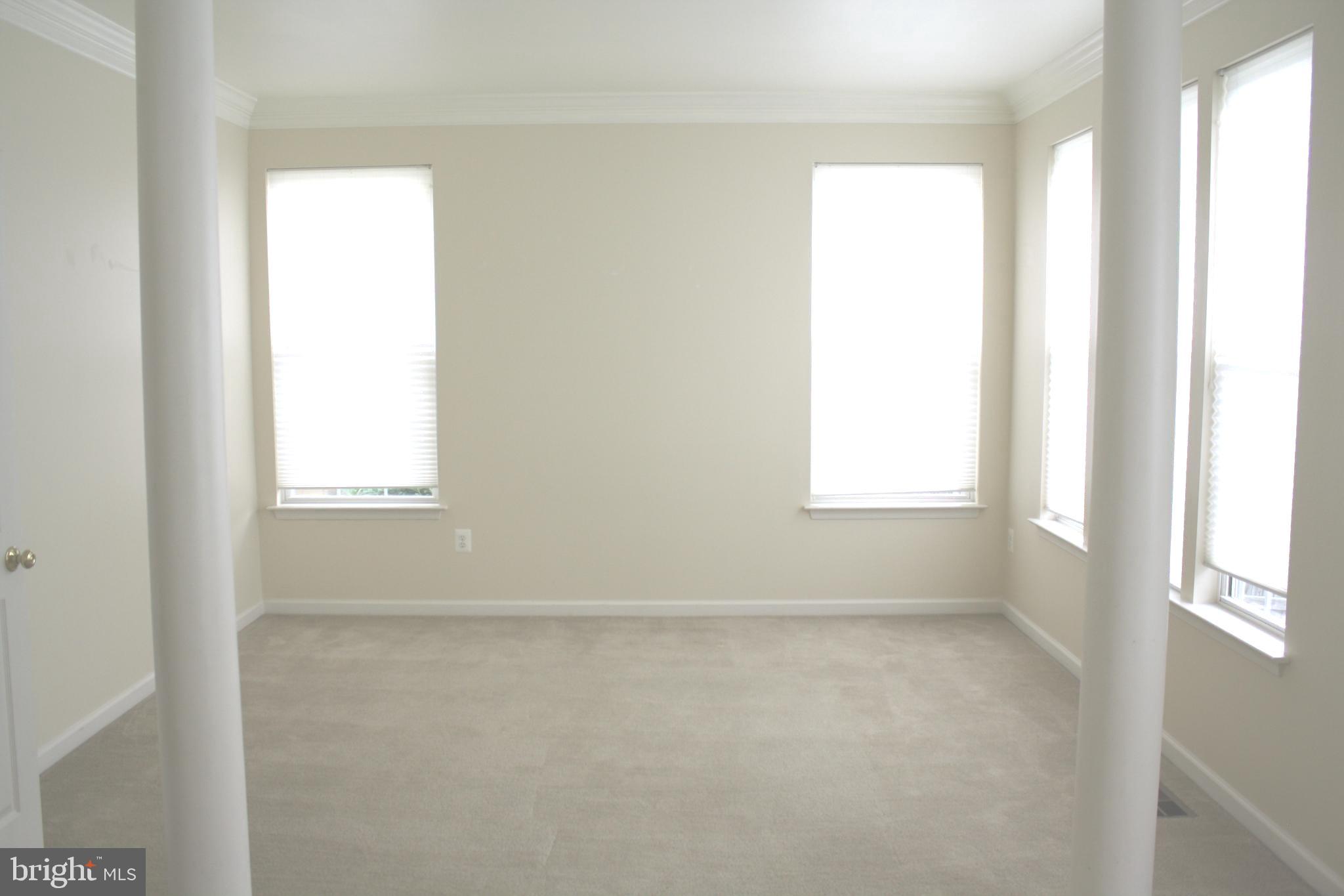 8378 Tillett Loop Manassas, VA 20110 - Photo 11 of 24 a view of an empty room with a window