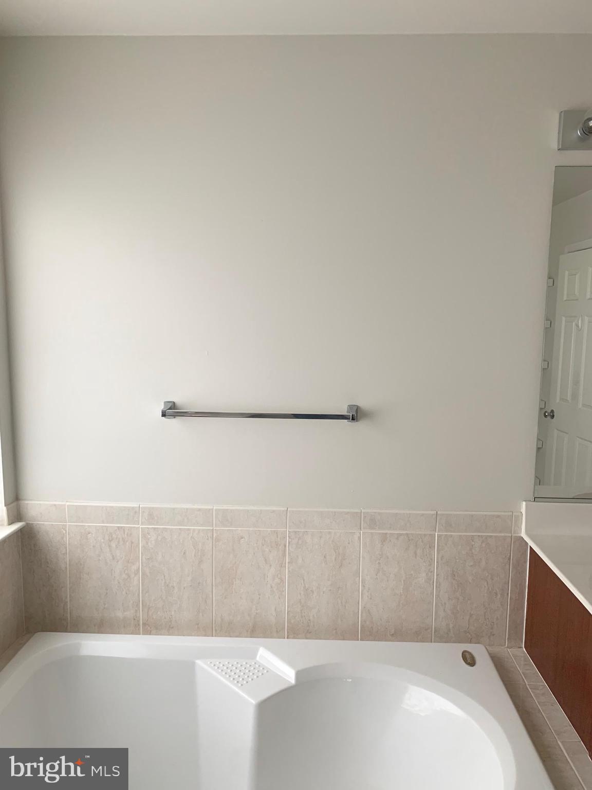 8378 Tillett Loop Manassas, VA 20110 - Photo 16 of 24 a bathroom with a bathtub and shower