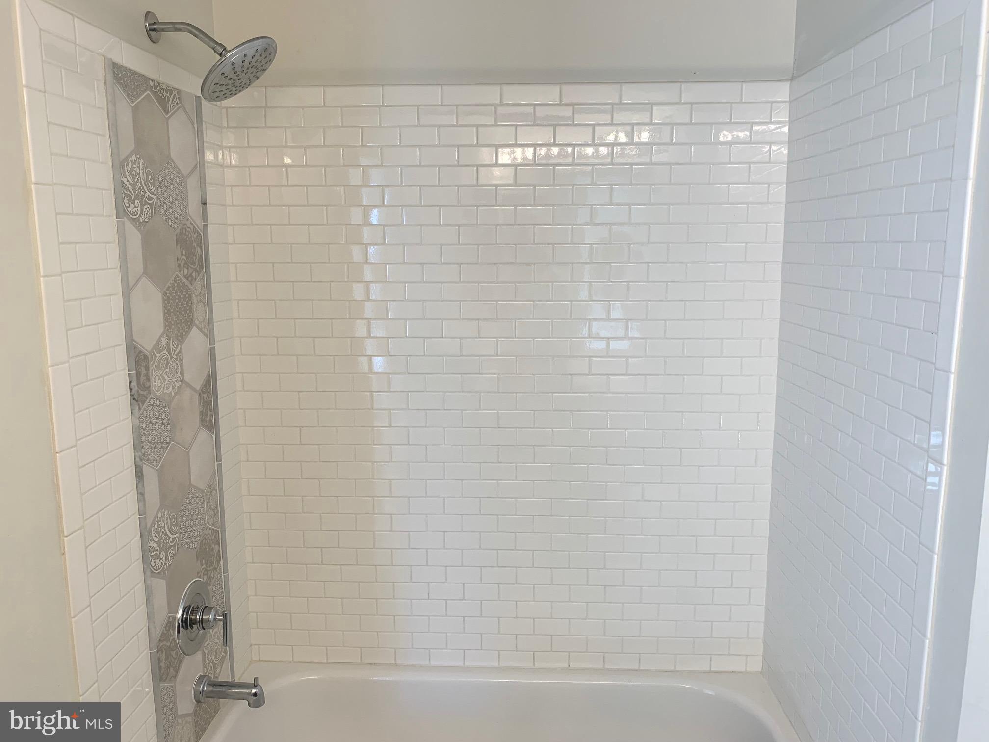 8378 Tillett Loop Manassas, VA 20110 - Photo 19 of 24 a bathroom with a shower