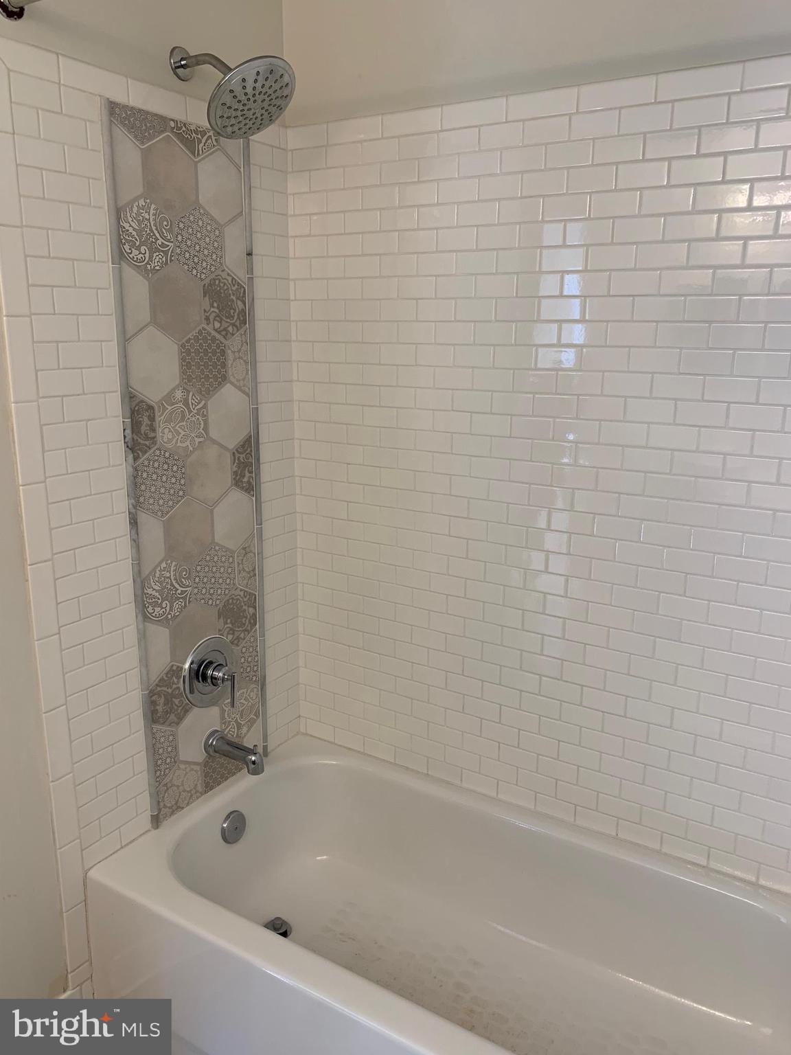 8378 Tillett Loop Manassas, VA 20110 - Photo 20 of 24 a bathroom with a bathtub