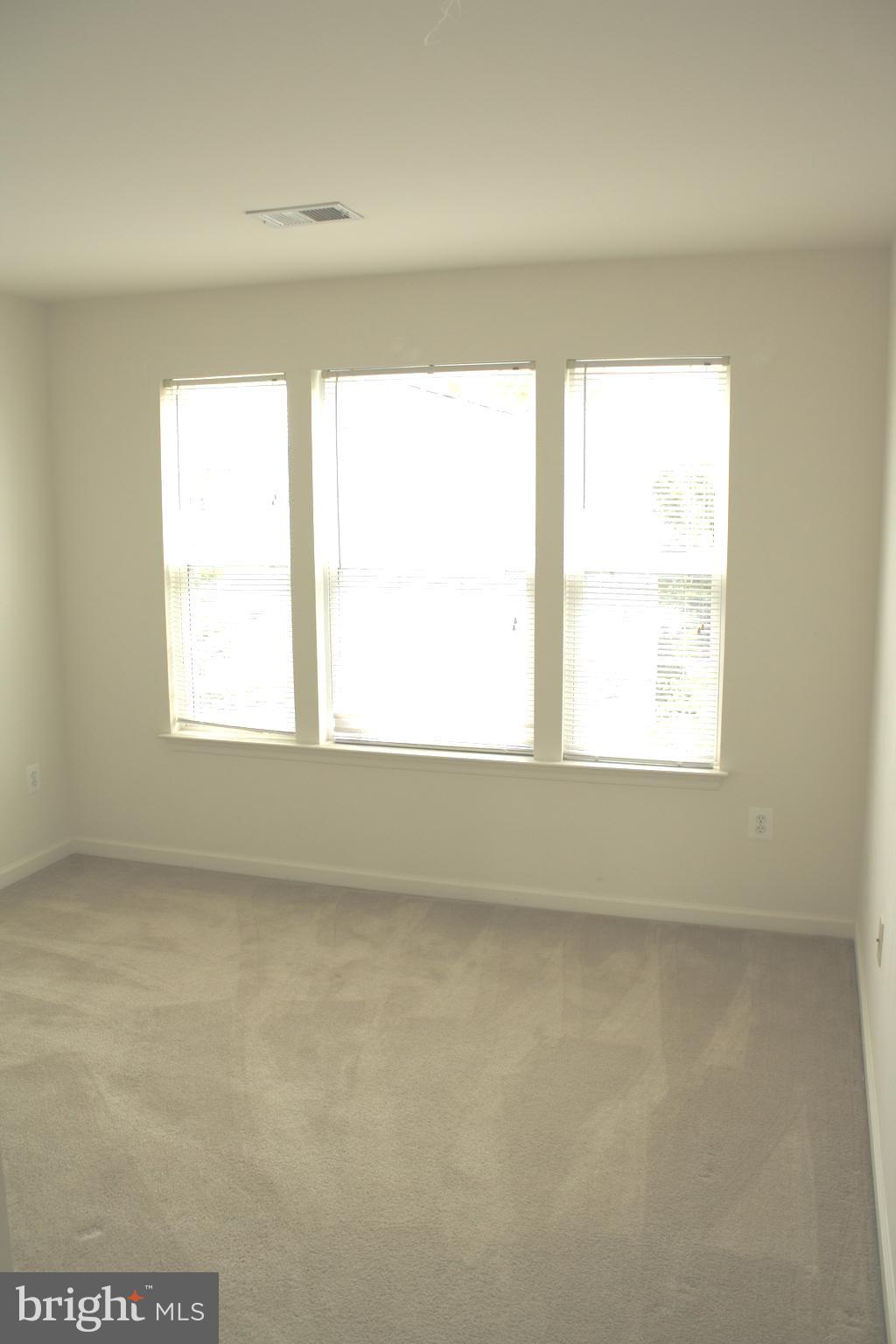 8378 Tillett Loop Manassas, VA 20110 - Photo 22 of 24 a view of an empty room with a window