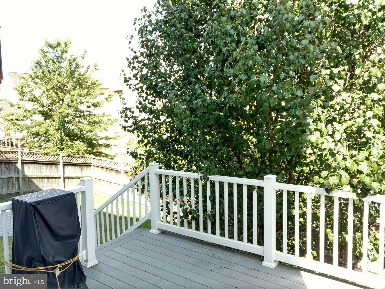 8378 Tillett Loop Manassas, VA 20110 - Photo 23 of 24 a view of a chair and table in the balcony