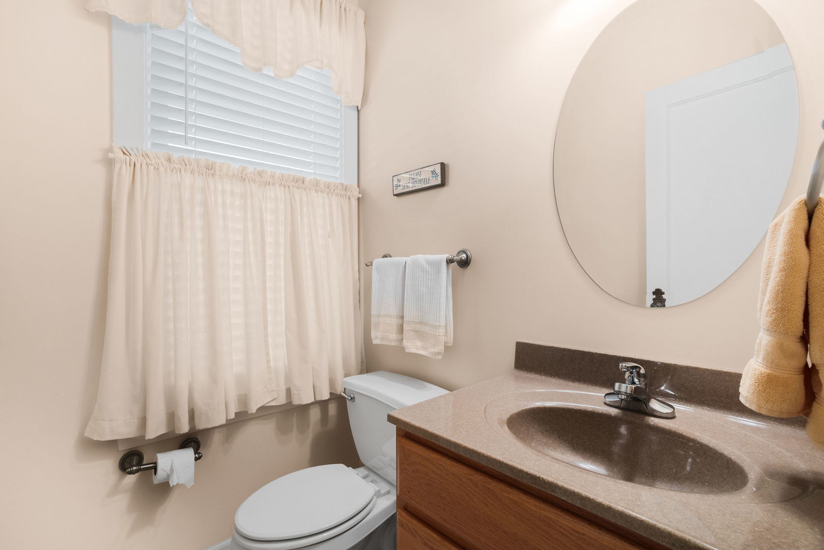 618 Woodward Street Beecher, IL 60401 - Photo 12 of 23 a bathroom with a granite countertop sink and a mirror with toilet