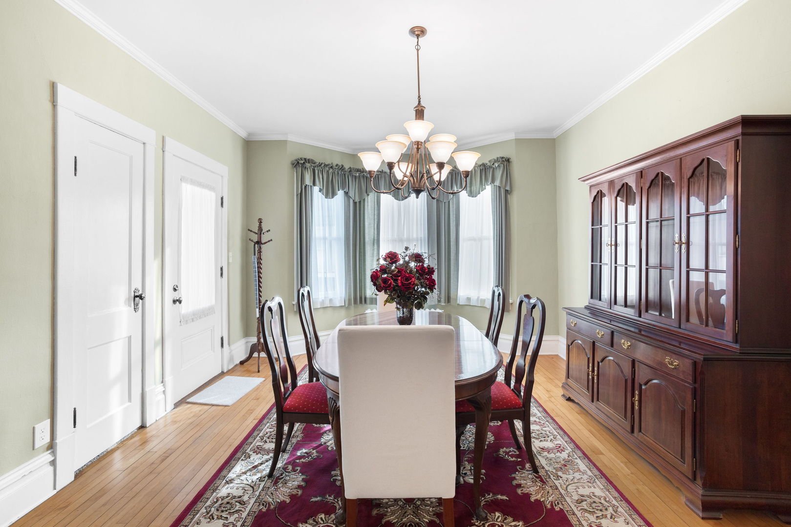 618 Woodward Street Beecher, IL 60401 - Photo 9 of 23 a dining room with furniture potted plants and wooden floor