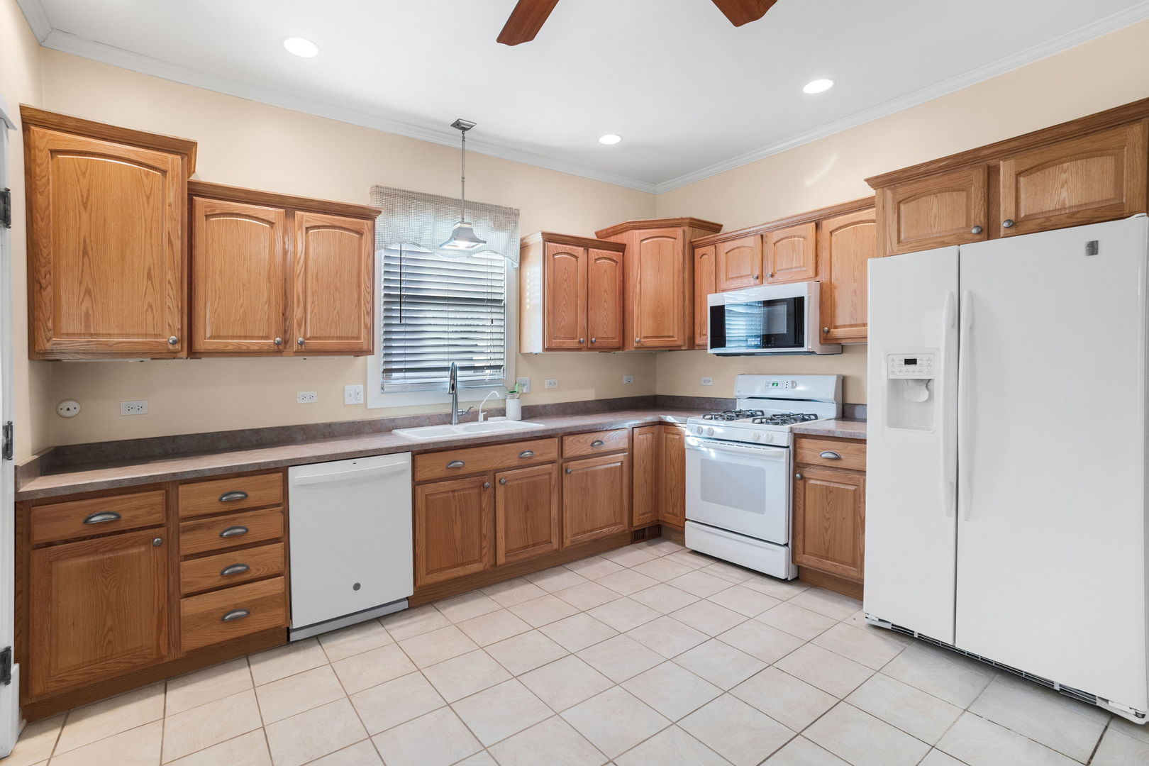 618 Woodward Street Beecher, IL 60401 - Photo 10 of 23 a kitchen with stainless steel appliances granite countertop a refrigerator and a stove top oven