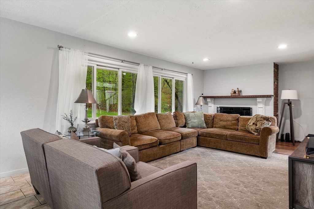 240 Worcester Road Barre, MA 01005 - Photo 14 of 38 a living room with furniture and a fireplace