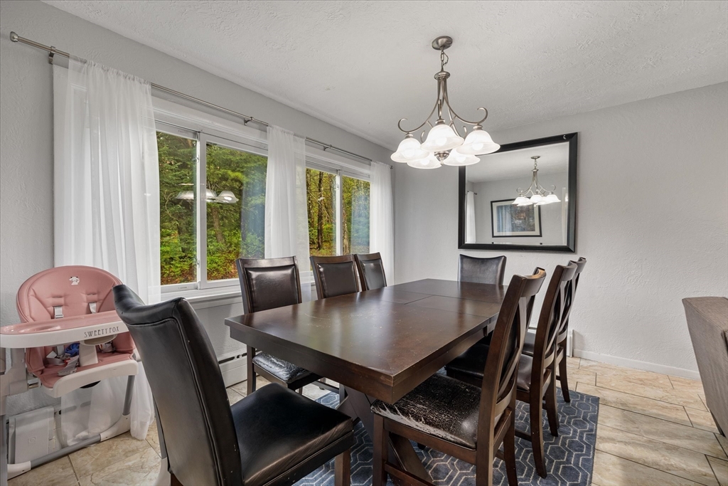 240 Worcester Road Barre, MA 01005 - Photo 15 of 38 a view of a dining room with furniture window and outside view
