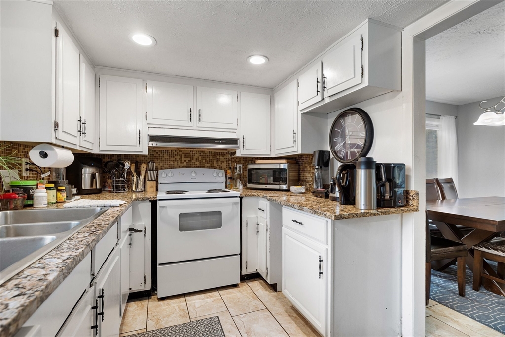 240 Worcester Road Barre, MA 01005 - Photo 17 of 38 a kitchen with a stove oven and a sink