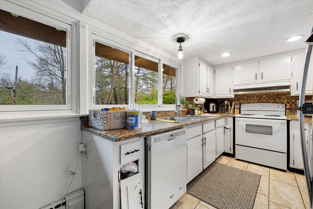 240 Worcester Road Barre, MA 01005 - Photo 18 of 38 a kitchen with granite countertop a sink stainless steel appliances and cabinets