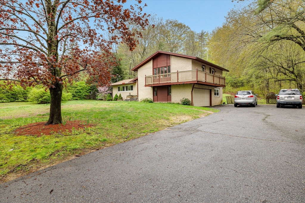 240 Worcester Road Barre, MA 01005 - Photo 3 of 38 a view of a house with a yard and large trees