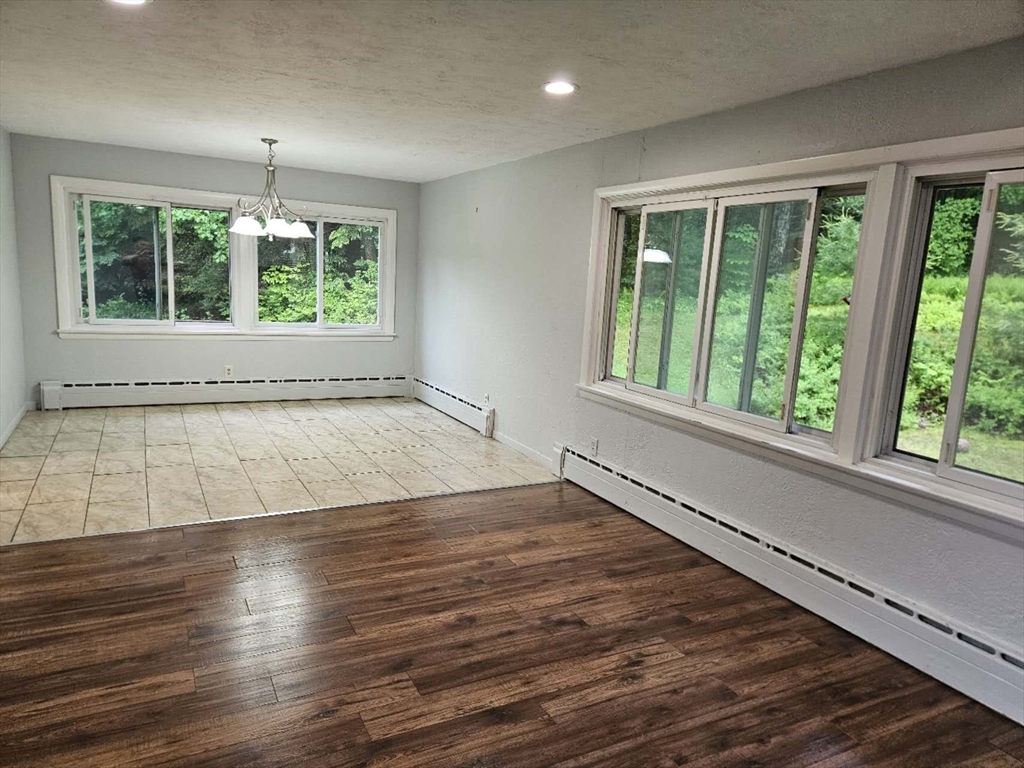 240 Worcester Road Barre, MA 01005 - Photo 37 of 38 an empty room with wooden floor and windows