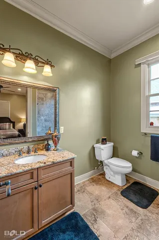 a bathroom with a sink toilet and mirror