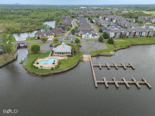 an aerial view of a house with a lake view