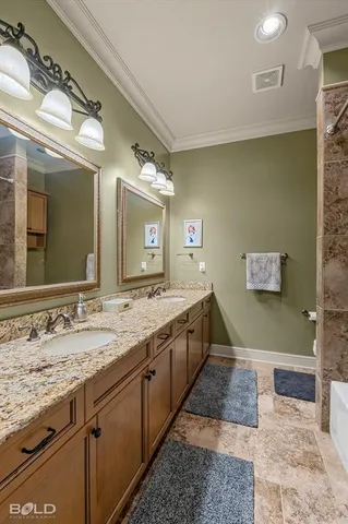 a spacious bathroom with a granite countertop sink and a mirror