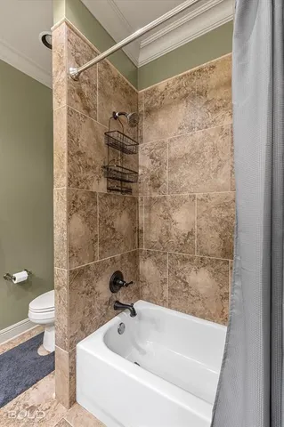 a bathroom with a shower and a toilet