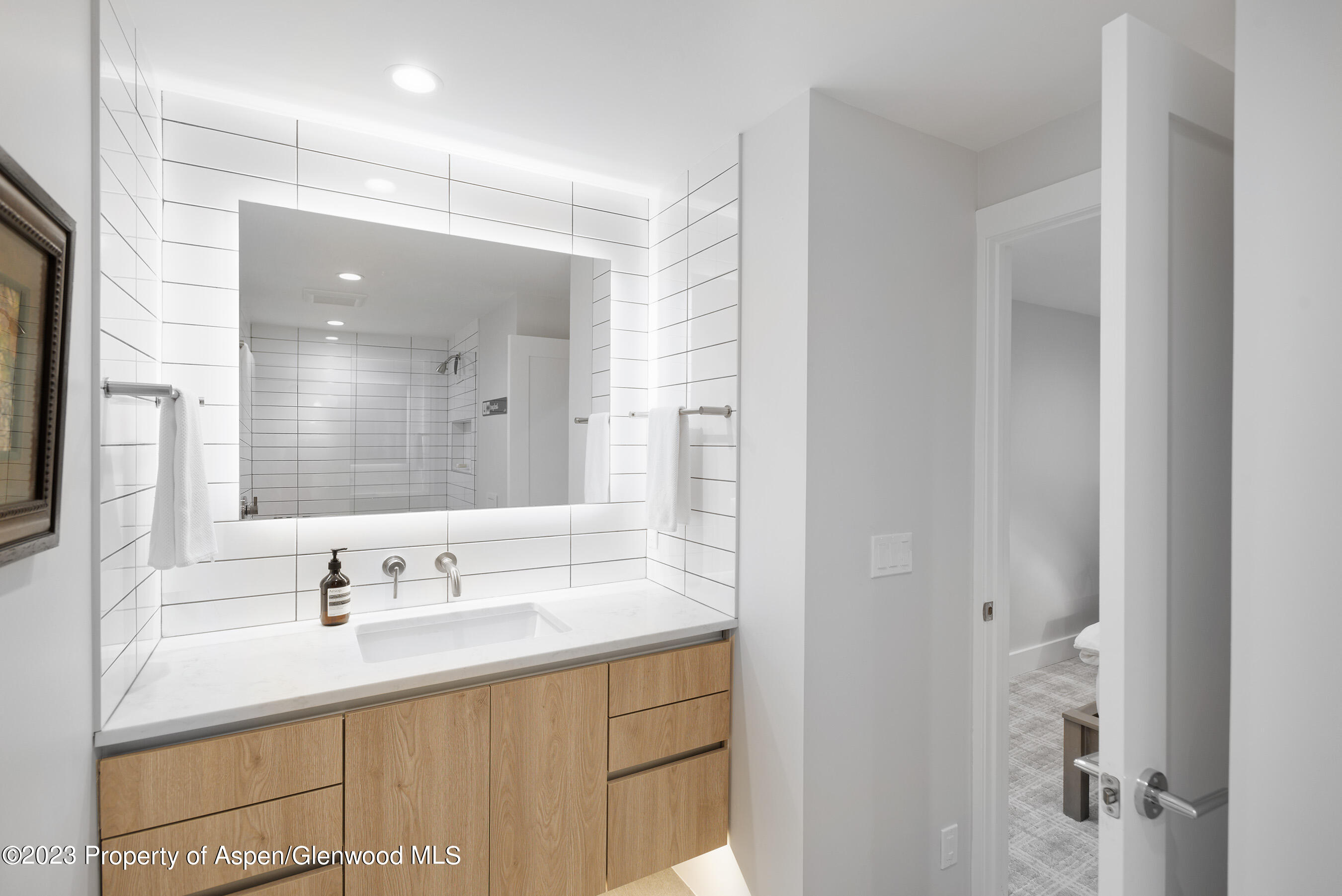 503 North 4th Street Aspen, CO 81611 - Photo 15 of 21 a bathroom with a sink and a mirror