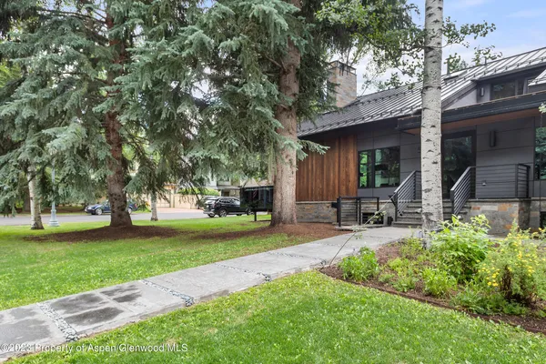 a view of a backyard with sitting area