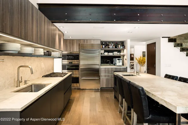 a kitchen with stainless steel appliances granite countertop a sink counter space and cabinets