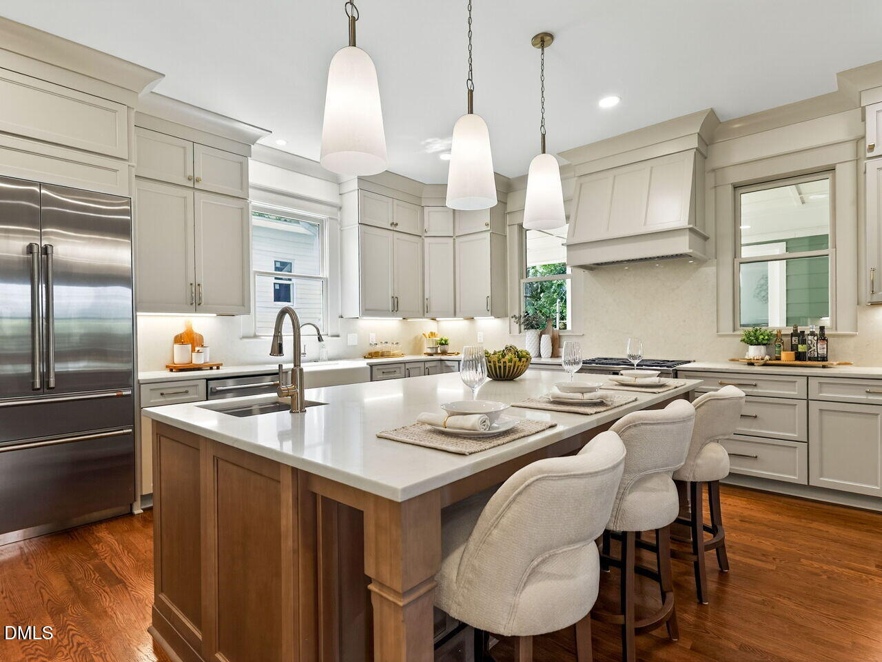 504 Tilden Street Raleigh, NC 27605 - Photo 4 of 58 a kitchen with a dining table chairs sink and cabinets