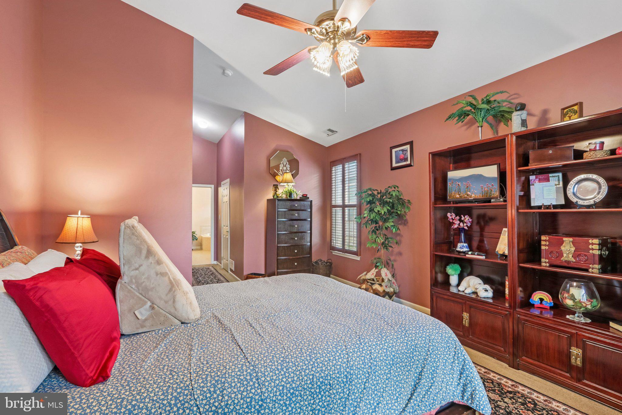 39 Danbury Road Swedesboro, NJ 08085 - Photo 26 of 62 a bedroom with a large bed and a chandelier