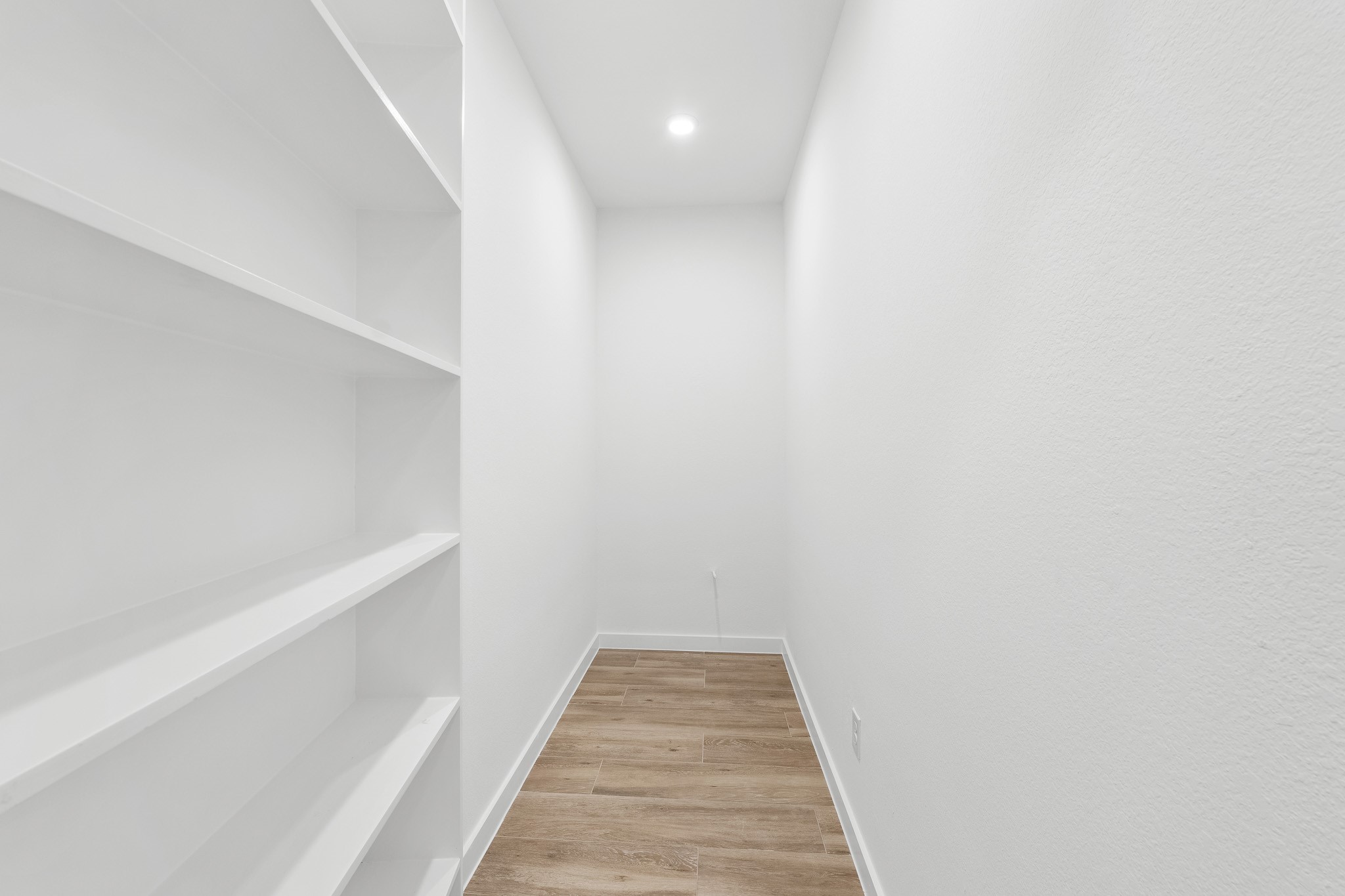 205 Tall Pine Livingston, TX 77351 - Photo 20 of 42 a view of a hallway with wooden floor