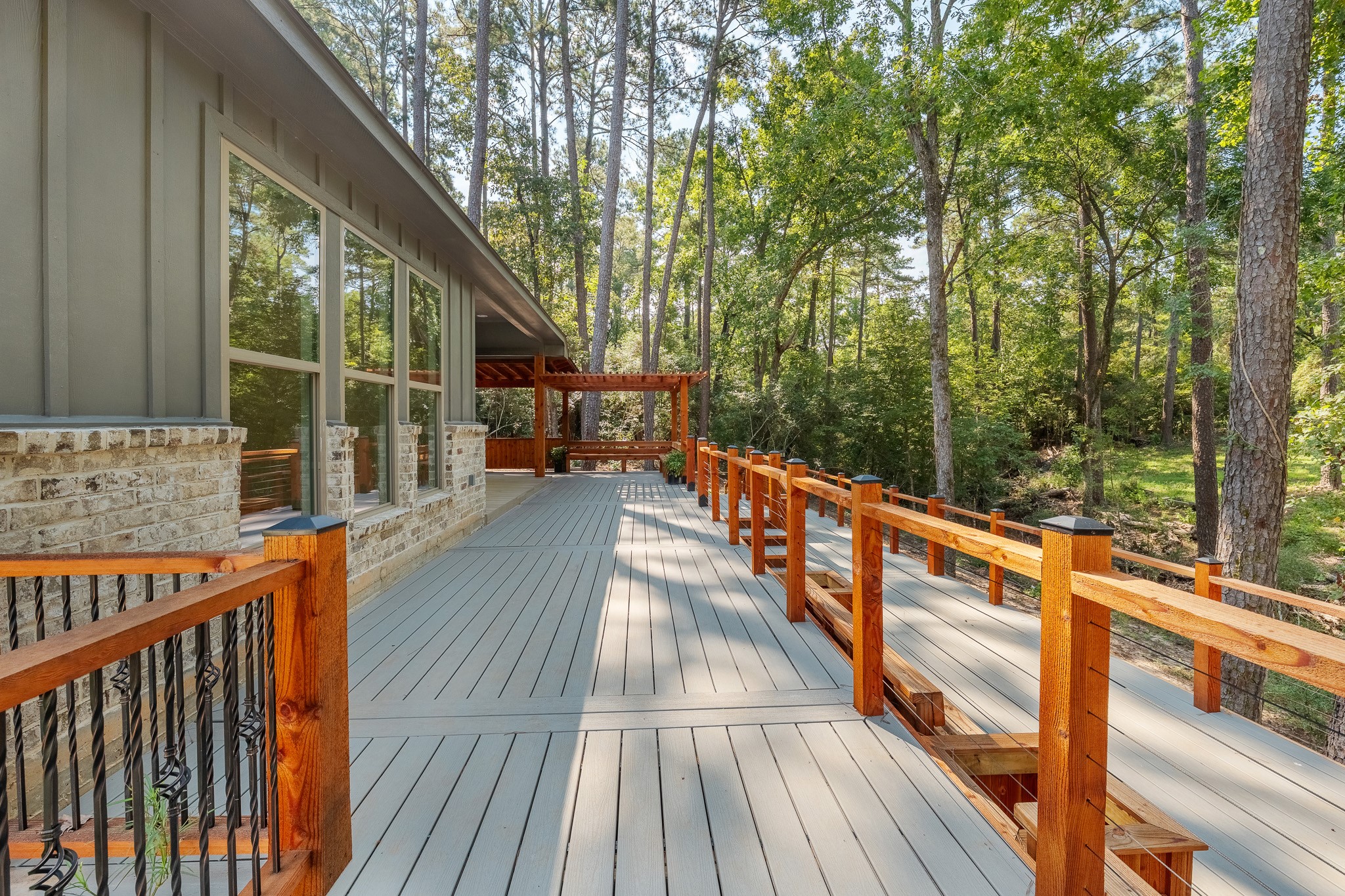 205 Tall Pine Livingston, TX 77351 - Photo 31 of 42 a view of balcony with wooden floor and fence