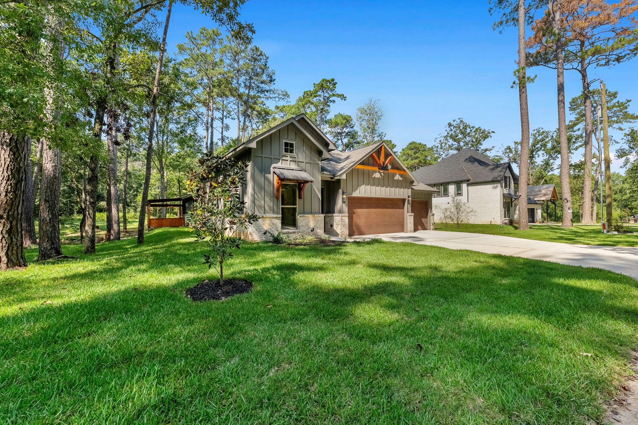 205 Tall Pine Livingston, TX 77351 - Photo 38 of 42 a front view of a house with a garden