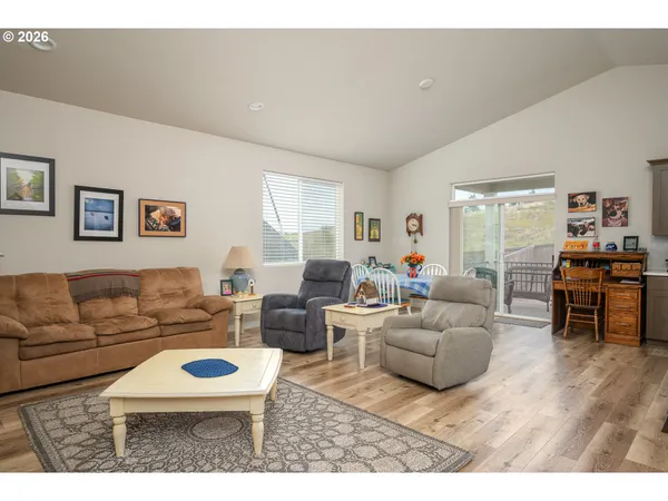 a living room with furniture and a table