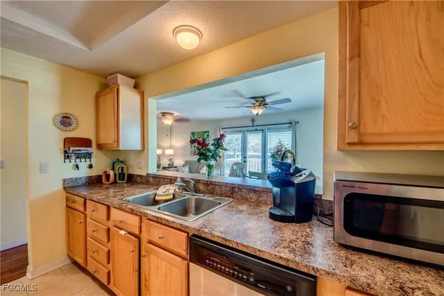 a kitchen with a sink and a stove top oven