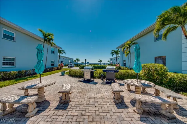 a view of a backyard with sitting area